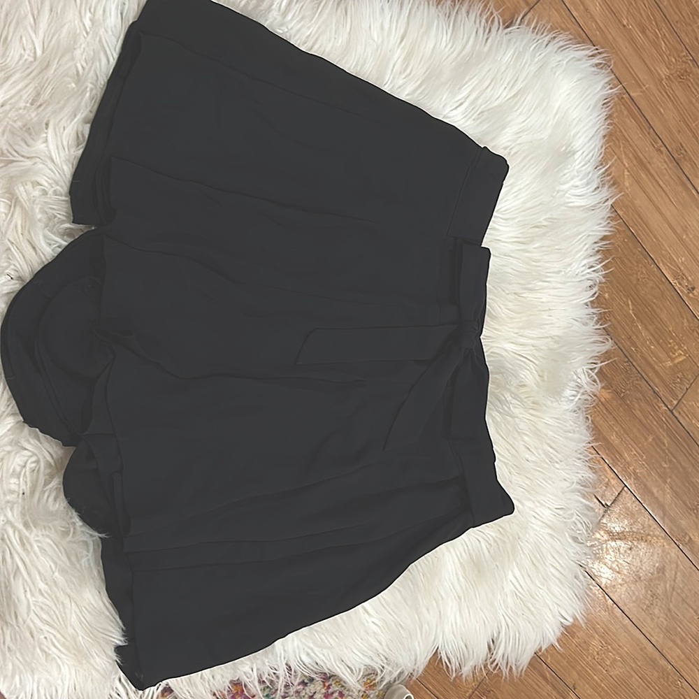 Pleated shorts.